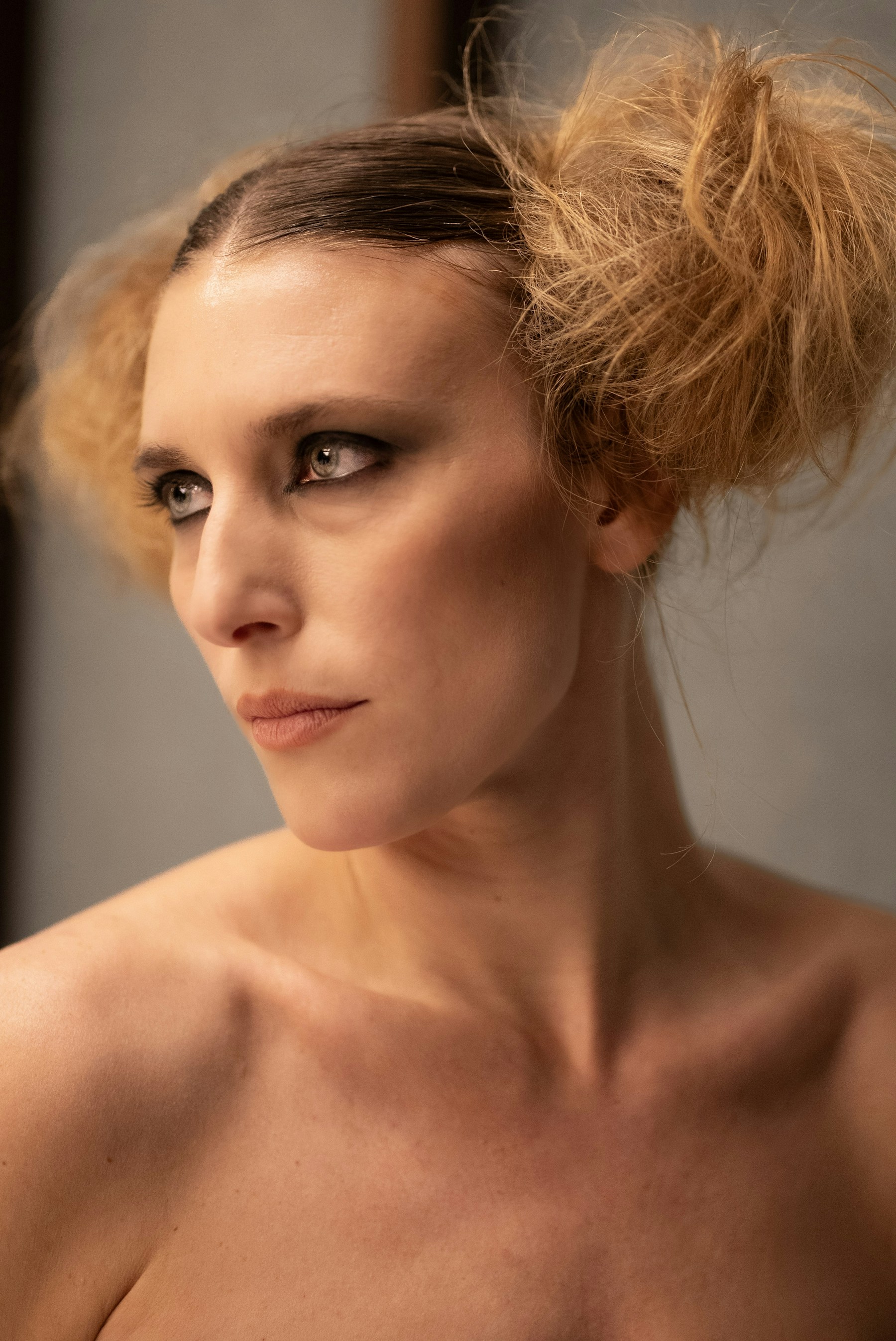 A fashion portrait featuring creative makeup and a sculpted hairstyle